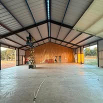 Elite Solutions of Texas barndominium metal building shell under construction in Northeast Texas