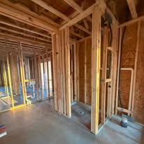 Framed interior walls during custom home construction by Elite Solutions of Texas
